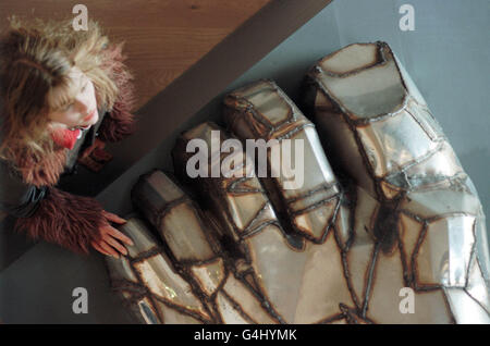 Man looks up at Paolozzi sculpture Stock Photo