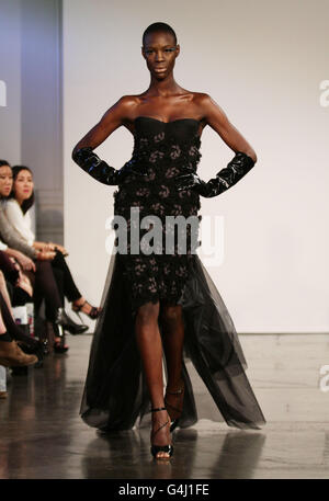 Models on the catwalk during the Bernard Chandran spring/summer 2012 show at The Show Space in Il Bottaccio, central London. Stock Photo