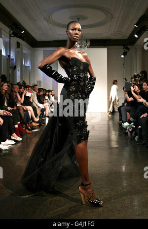 Models on the catwalk during the Bernard Chandran spring/summer 2012 show at The Show Space in Il Bottaccio, central London. Stock Photo