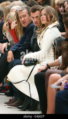 Mario Testino (left), Andy Murray and his girlfriend Kim Sears during the Burberry Prosum Spring/Summer 2012 Show in Kensington, London, as part of London Fashion Week. Picture date: Monday September 19, 2011. Stock Photo