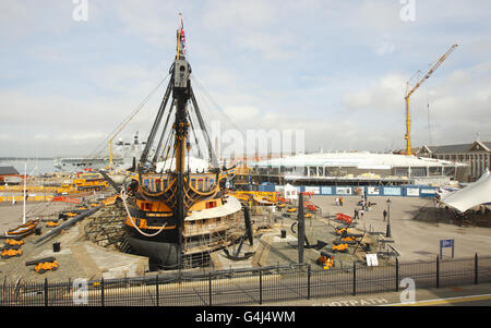 Admiral Lord Nelson's famous flagship HMS Victory stands minus her top-masts and bow-sprit at the Royal Navy Dockyard in Portsmouth. Stock Photo