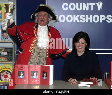 Monica Lewinsky signs a copy of her autobiography 'Monica's Story' for Chelmsford Town Crier Tony Appleton, at the Lakeside Shopping Centre near Thurrock in Essex. Stock Photo
