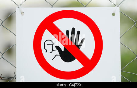 No Entry Sign on Wire Fence Stock Photo