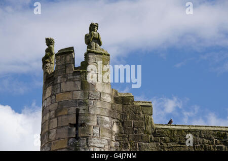 Close-up of stone carved figures on top of Monk Bar, an ancient medieval 14thC gatehouse - York, North Yorkshire, England. Stock Photo