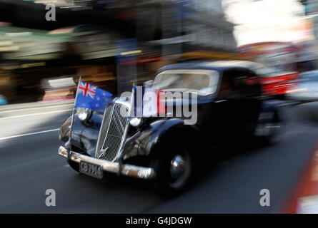 A vintage Citroen shows the flags of New Zealand and France on Queen Street in central Auckland, New Zealand. Stock Photo