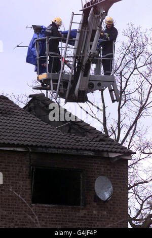 Bodies removed from house fire Stock Photo