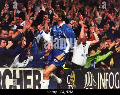Chelsea's Tore Andre Flo celebrates with the fans after scoring the equalising goal during the European Cup Winners Cup semi-final 1st leg football match against Real Mallorca, at Stamford Bridge. Stock Photo