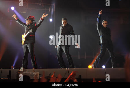 The Jacksons (left - right) Tito, Jackie and Marlon perform at the Michael Forever Tribute Concert at the Millennium Stadium, Cardiff. Stock Photo