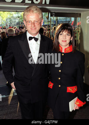 Writer Richard Curtis and his partner, writer and presenter Emma Freud, arriving for the World Premiere of his new film 'Notting Hill', at the Odeon Leicester Square. Stock Photo
