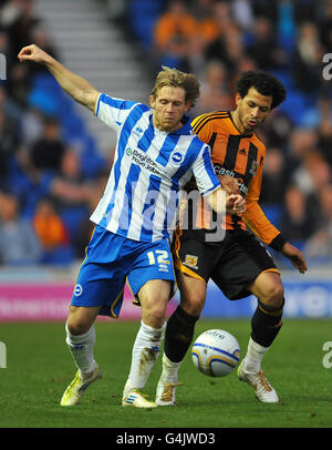 Soccer - npower Football League Championship - Brighton & Hove Albion v Hull City - Amex Stadium. Brighton and Hove Albion's Craig Mackail-Smith (left) and Hull City's Liam Rosenior battle for the ball Stock Photo