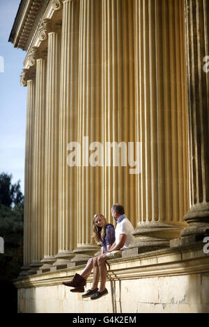 (Left to right) Saskia and David Wilson from Hanley on Thames at the temple of Concord and Victory in Stowe Landscape Gardens, a National Trust property in Buckinghamshire, as the trust celebrates reaching 4 million members. Stock Photo