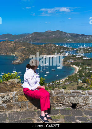 dh Shirley Heights ANTIGUA CARIBBEAN Woman tourist lookout at view of Nelsons Dockyard Falmouth english harbour harbor holiday Stock Photo