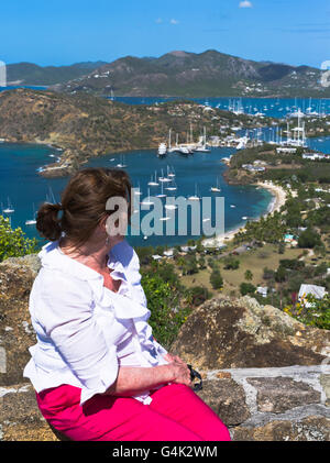 dh Shirley Heights ANTIGUA CARIBBEAN Woman tourist lookout at view of Nelsons Dockyard Falmouth harbour Stock Photo