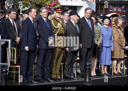 Front left to right. Prime Minister David Cameron, Defence Secretary Philip Hammond and Chief of General Staff General Sir Peter Wall stand with dignitaries at the commemoration event in Wootton Bassett, which is receiving the royal Letters Patent. Stock Photo
