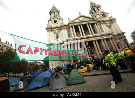 Protesters, who are part of the Occupy London Stock Exchange demonstration, outside St Paul's Cathedral, London. Stock Photo