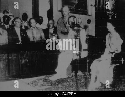 **Scanned low-res from contact** The Queen, with the Duke of Edinburgh, hears an address of welcome from the Legislative Council in Headquarters House, Kingston, Jamaica. Stock Photo