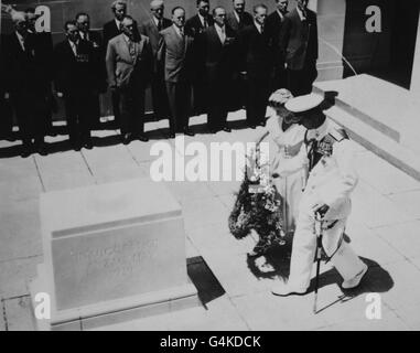 The Queen and Duke of Edinburgh carry their wreath to the commemoration stone in the ceremony at the Australian National War Memorial in Canberra. Stock Photo