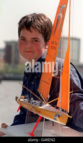 Ellen MacArthur, 22, holds a model of the Class 60 yacht Kingfisher, which she will attempt to race single-handed around the World in the Vendee Globe. The 26,000 race is due to start from Les Sables d'Olonne in France on November 5, 2000. Stock Photo
