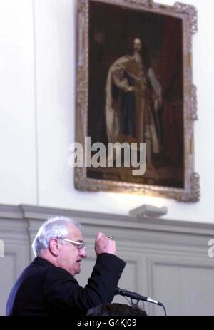 Archbishop Robin Eames, Church of Ireland Primate, addresses the Annual Church of Ireland Synod in Dublin. Above him is a portrait of King William III, who was revered by the Orange Order. Stock Photo