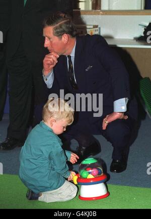 HRH The Prince of Wales with Callum Trahair, aged 2, at the Chapel Street Methodist Church Parent, Toddler and Babies Group meeting at the Wharfside Shopping Centre in Penzance. Stock Photo