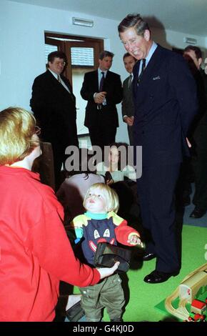 HRH The Prince of Wales meets Michelle Howells and her son Matthew, aged 1, during a visit to the Chapel Street Methodist Church Parent, Toddler and Babies Group meeting at the Wharfside Shopping Centre in Penzance. Stock Photo