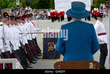 The Queen attends a ceremony to present new colours (Regimental Flags), to the Australian Royal Military College at Duntroon in Canberra Australia. Stock Photo