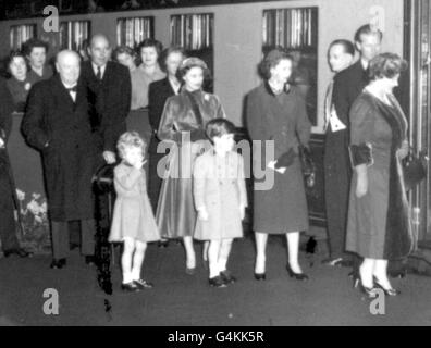 (Left - right, foreground) Sir Winston Churchill, Princess Anne, Princess Margaret, Prince Charles, Queen Elizabeth II, the Duke of Edinburgh and the Queen Mother, at Waterloo Station in London where the Queen left on a train to Southampton to board the Cunard liner Queen Elizabeth for a trip to New York at the start of a one month tour of the United Sates and Canada. Stock Photo