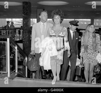 Welsh actor, Richard Burton and his actress wife, Elizabeth Taylor at London's Heathrow airport before departing for Sicily. Stock Photo