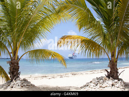 The view of Seven Mile beach with a cruise ship in a background (Grand Cayman, Cayman Islands). Stock Photo