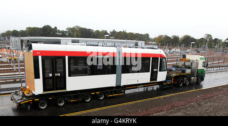 The first tram is delivered to the Gogar depot in Edinburgh. The vehicle which was split into seven modules for its 1500km journey from Irun, northern Spain arrived on board three low loader lorries. Stock Photo