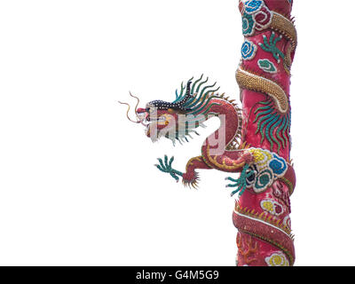 Chinese dragon statue on the pole isolated on white background with clipping path Stock Photo
