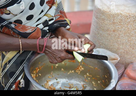 Mumbai, India - October 26, 2015 - Indian food charmuri prepared by woman in Mumbai Stock Photo