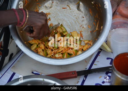 Mumbai, India - October 26, 2015 - Indian food charmuri prepared by woman in Mumbai Stock Photo