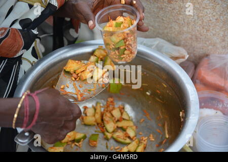 Mumbai, India - October 26, 2015 - Indian food charmuri prepared by woman in Mumbai Stock Photo