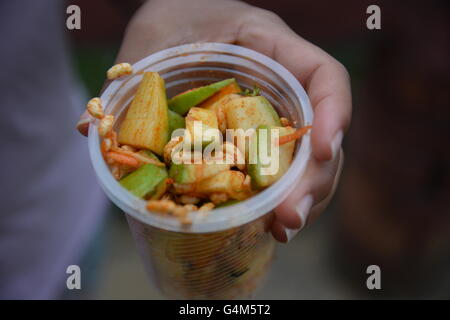 Mumbai, India - October 26, 2015 - Indian food charmuri prepared by woman in Mumbai Stock Photo