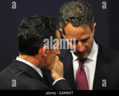 France's President Nicolas Sarkozy talks with U.S Secretary of Treasury Timothy Geithner on the second day of the G20 Summit in Cannes, France today. Stock Photo