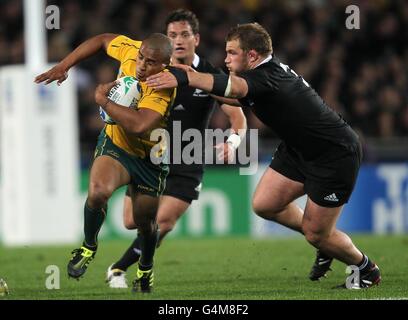 Rugby Union - Rugby World Cup 2011 - Semi Final - Australia v New Zealand - Eden Park. Australia's Will Genia (left) and New Zealand's Owen Franks (right) Stock Photo