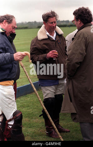 The Prince of Wales relaxes with a drink after playing polo for Cirencester Park against Lovelocks, in the Dalwhinnie Crook match at Birdlip, Gloucestershire. Stock Photo