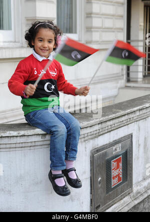 Bilquees Ageli from Libya celebrates outside the Libyan Embassy, Knightsbridge, London, following the news that Libyan dictator Muammar Gaddafi has died. Stock Photo