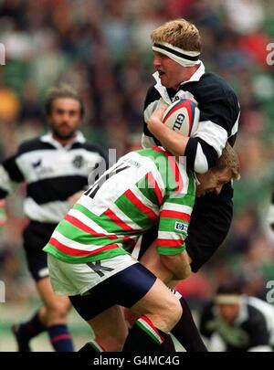 Barbarians World XV Doddie Weir (with ball) is tackled by David Lougheed during their clash against Leicester Tigers for the Scottish Amicable Trophy at Twickenham in London. Final score Barbarians 55, Tigers 33. Stock Photo