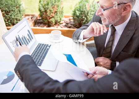 Positive man working on the laptop Stock Photo