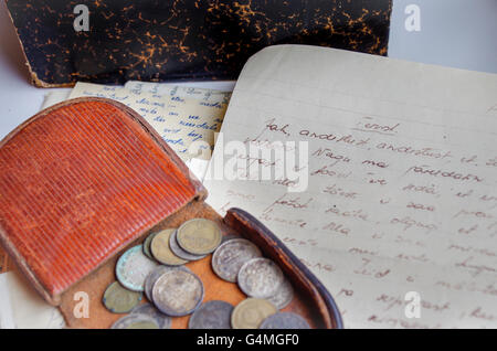 Leather coin pouch with coins from the Russian Empire and handwritten love letters from 1930s Stock Photo