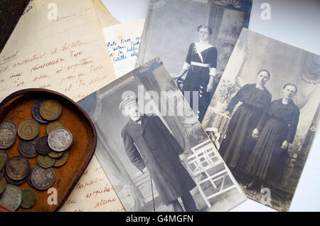 Old coins from the Russian Empire, handwritten love letters from the 2nd World War era and several old b&w family photos Stock Photo