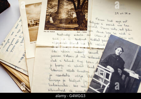 Old handwritten letters from 1939 with a black and white photo of a seated woman in period dress attached Stock Photo