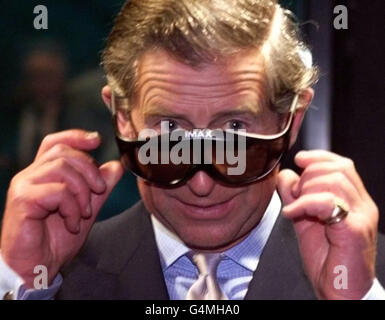 Britain's Prince of Wales wears 3D glasses at the opening Friday June 11, 1999 of the British Film Institute's IMAX cinema in Waterloo, London. The cinema will show 2D and 3D films on a screen which is more than 20 metres high and 26 metres wide. Backed by a 15 million grant from the Arts Council of England s Lottery Fund, the 20 million purpose-built cinema immerses viewers in larger-than-life images and realistic digital sound. Stock Photo