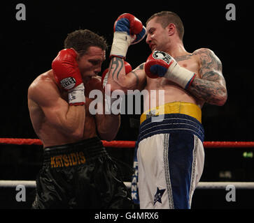 Scotland's Ricky Burns (right) in action with Australia's Michael Katsidis following the WBO Interim Lightweight Title fight at Wembley Arena, London. Stock Photo