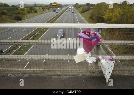 Floral tributes are attached to a motorway bridge on Hyde Lane across the M5 in Somerset, close to where a 34-vehicle pile-up which claimed seven lives and left 51 injured. Stock Photo