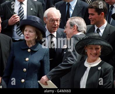 Former Prime Minister Baroness Thatcher leaving the memorial service for the late King Hussein at St Pauls Cathedral in London. Thatcher's husband Denis (centre) talks to King Constantine of Greece (centre right) as his wife Queen Anne-Marie looks on. * More than 2,000 people attended the hour-long service in memory of the king, who died from cancer 7/2/99. Stock Photo