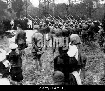 The military funeral of Baron Manfred Freiherr von Richthofen,the 'Red Baron', shot down on the 21st of April, 1918. At his burial at the village of Bertangles, near Amiens, riflemen from No.3 Squadron, Australian Flying Corps fired three volleys over the grave in tribute to the airman who had chalked up 80 kills. Stock Photo