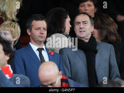 Soccer - Barclays Premier League - Manchester United v Sunderland - Old Trafford. English actor Angus Deayton (right) in the stands Stock Photo